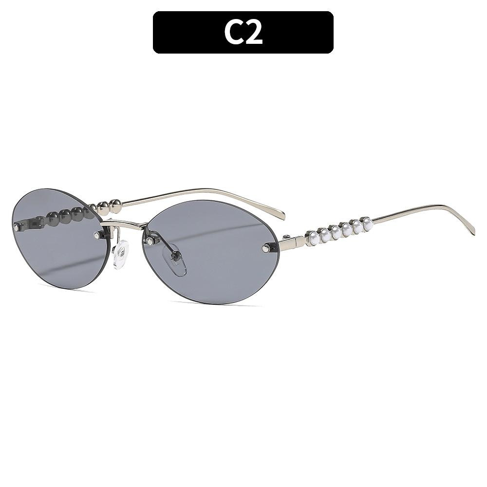 Ladies sunglasses, rimless oval sunglasses, pearl embellished sunglasses.