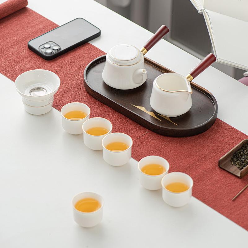 Light luxury suet jade white porcelain kung fu tea set, household gold-painted high-end < unk > pot tea cup gift box hardcover