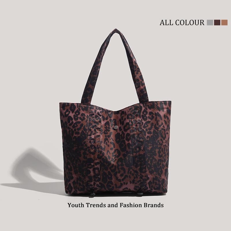 

Leopard print canvas shoulder bag women s new large-capacity portable college student class commuter bag