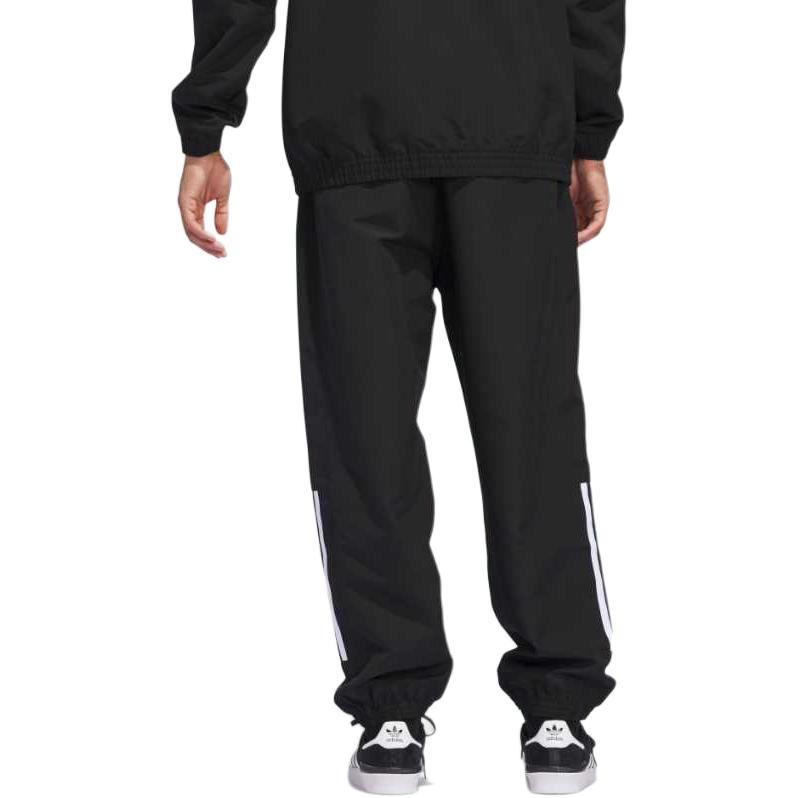 adidas Originals Skateboarding Gatsele Serie Deportiva Clásica Pantalones de Sudor de Punto Suelto a Rayas con Bloque de Color para Hombre Parte Inferior Negro Blanco JC5172