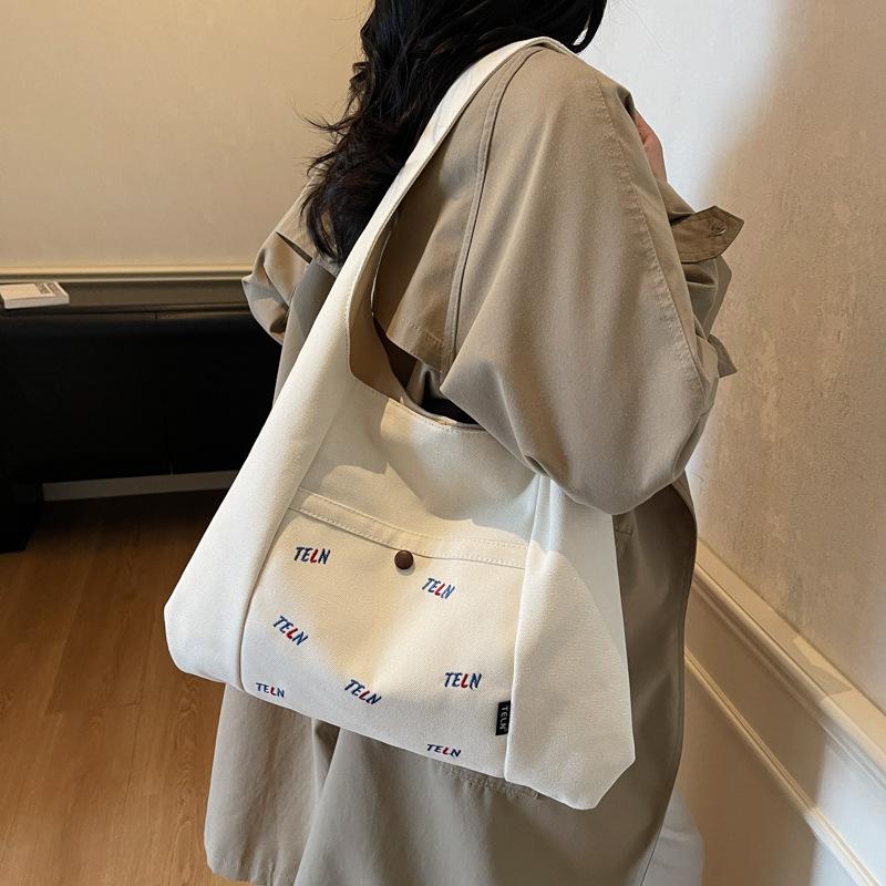 Canvas Bag Women's 2025 Autumn New Fashion Shoulder Bag Large Capacity Commuting Korean Niche Design Underarm Bag