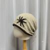 Retro contrasting color curled edge knitted drawstring stacking hat for children, warm and cold in autumn and winter, showing a small face, big head c