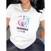 A Short-Sleeved T-Shirt In Black and White for Grandma, Featuring A Pink or Blue Footprint Design. It'S Great for Family Events,