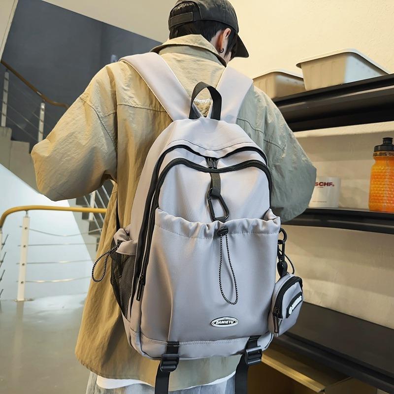 Backpack simple and fashionable college student junior high school student schoolbag female nylon large capacity leisure travel backpack male