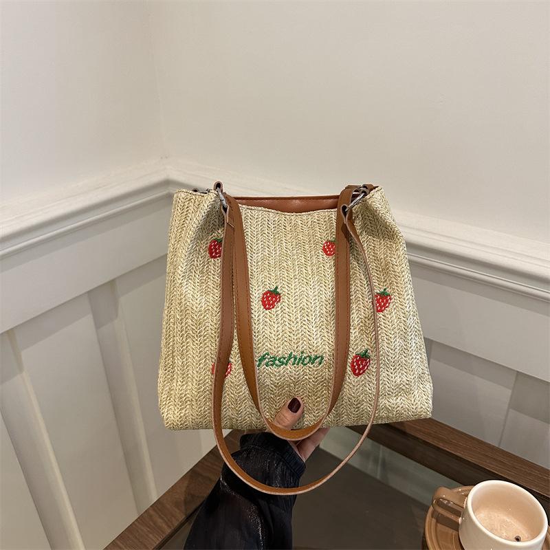 Versatile seaside beach vacation straw bag 2025 new shoulder large capacity fashionable strawberry embroidered bucket bag