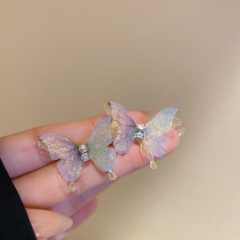 Boucles d'oreilles bohèmes roses à fleurs de perles de rocaille et pompons de perles