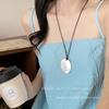 Fashion sense small comb titanium steel black rope pendant necklace women's high-end sweater chain long sweater chain accessories