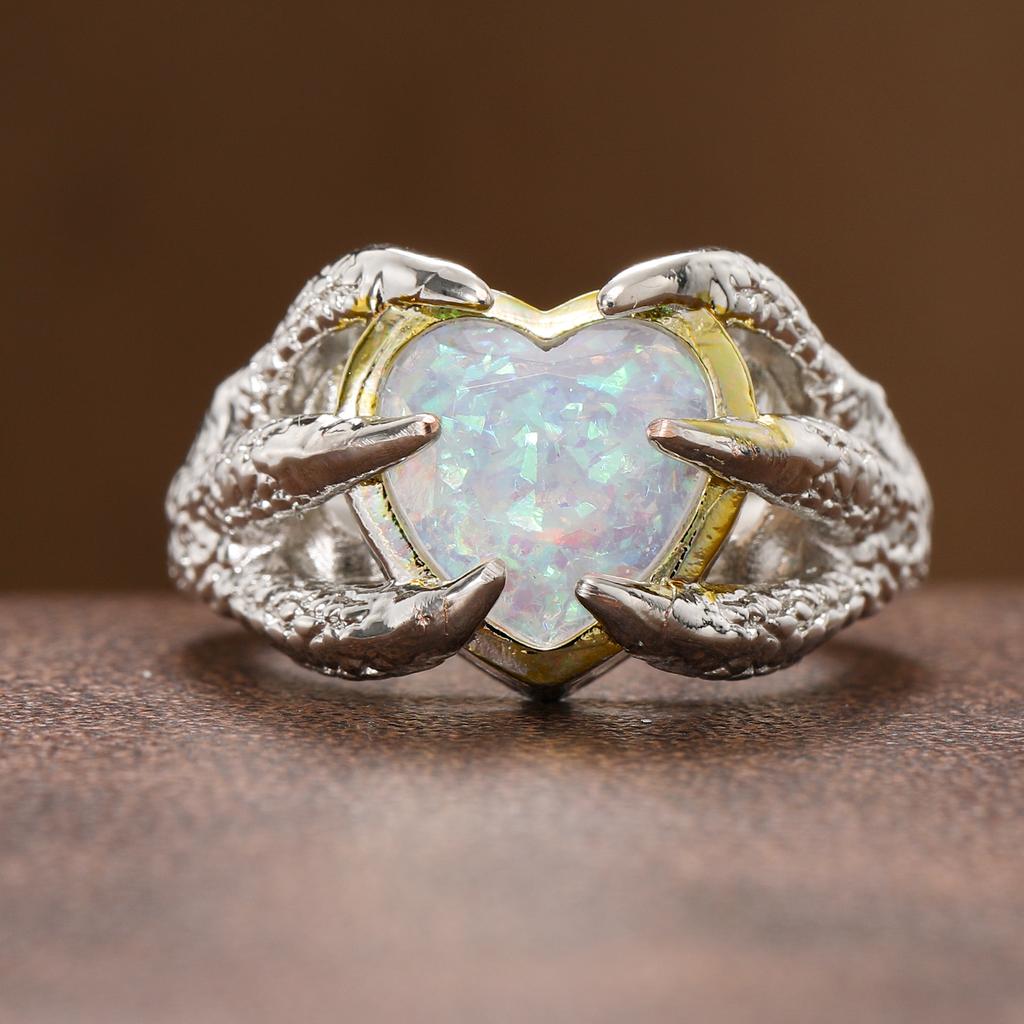 Fashion claw-set heart-shaped synthetic gemstone ring made of copper, for ladies' jewelry, suitable for parties and banquets.
