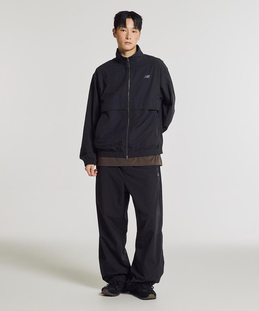 New Balance Nbnag31803 / Uni Essential Heritage Opstaande Kraag Opwarmjack (Zwart)