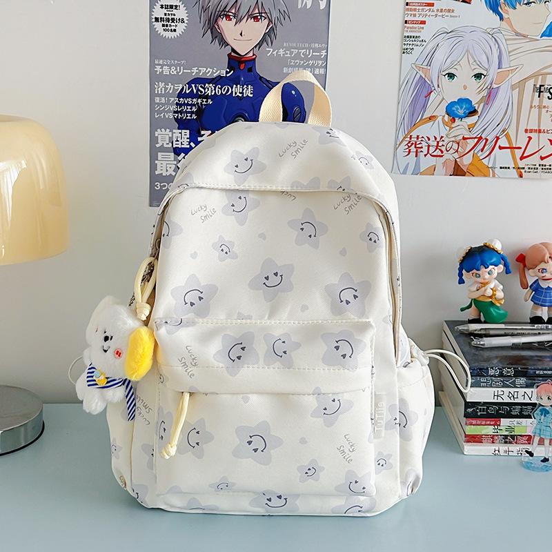 Nowy tornister jest wysokiej jakości, świeży, słodki i uroczy, a plecak w gwiazdki to lekki plecak podróżny dla uczniów gimnazjum.