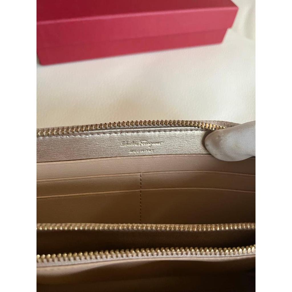 Used Excellent condition  Ferragamo long wallet, round zip, Gancini, leather, gold hardware