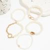 5-Piece Ocean-Inspired Faux Pearl Bracelet Set for Women with Bow, Heart, and Shell Accents