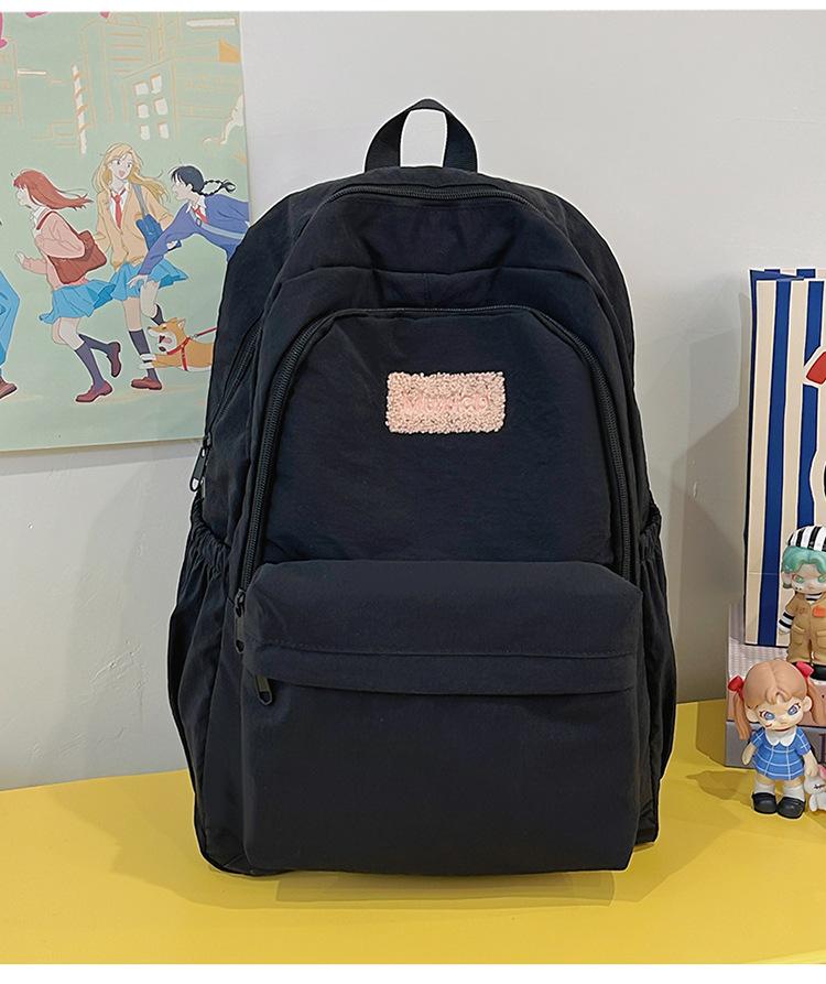 

School bag 2025 new large-capacity sweet and cute college student school bag Korean version fresh and versatile backpack casual and lightweight bag