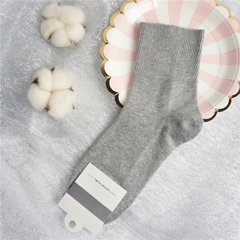 Damen Herbst- und Winter Baumwolle Lockerer Bund Zieht den Fuß nicht Hochrohrsocken