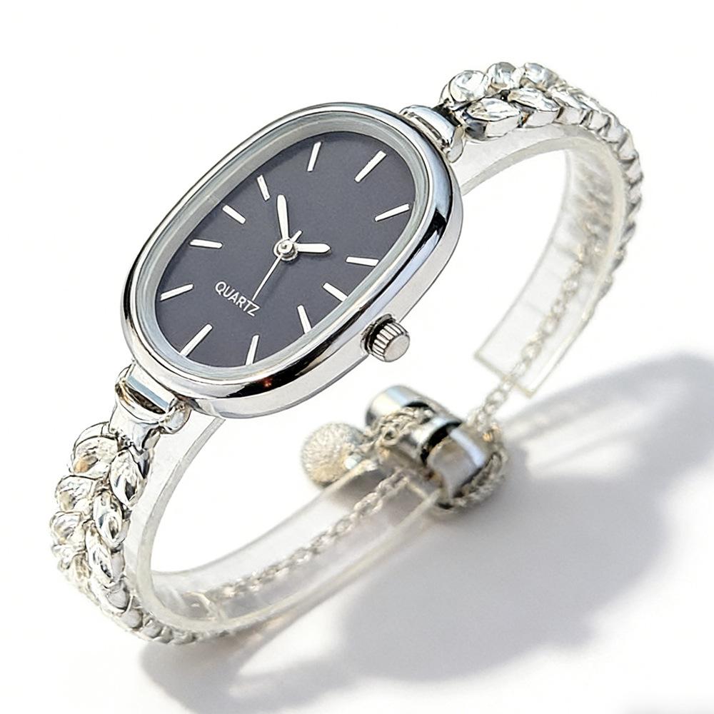 

Elegant Ladies Gold Diamond Bracelet Watch - Oval Dial Quartz Wristwatch