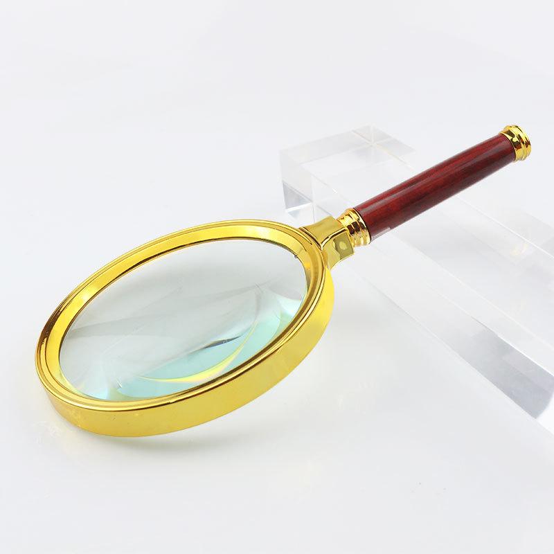 Handliche Lupe mit hoher Vergrößerung, Griff in Mahagoni-Imitation und vergoldetem Rand - Ideal zum Lesen für Senioren