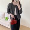 Autumn new solid color round neck single-breasted splicing long-sleeved knitted sweater women's fashion age-reducing top