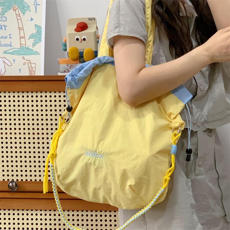 Niche Canvas Bag Color Matching Drawstring Adjustable Shoulder Strap Multi-function Hand Carry Contrasting Color Light Crossbody Shoulder Bag