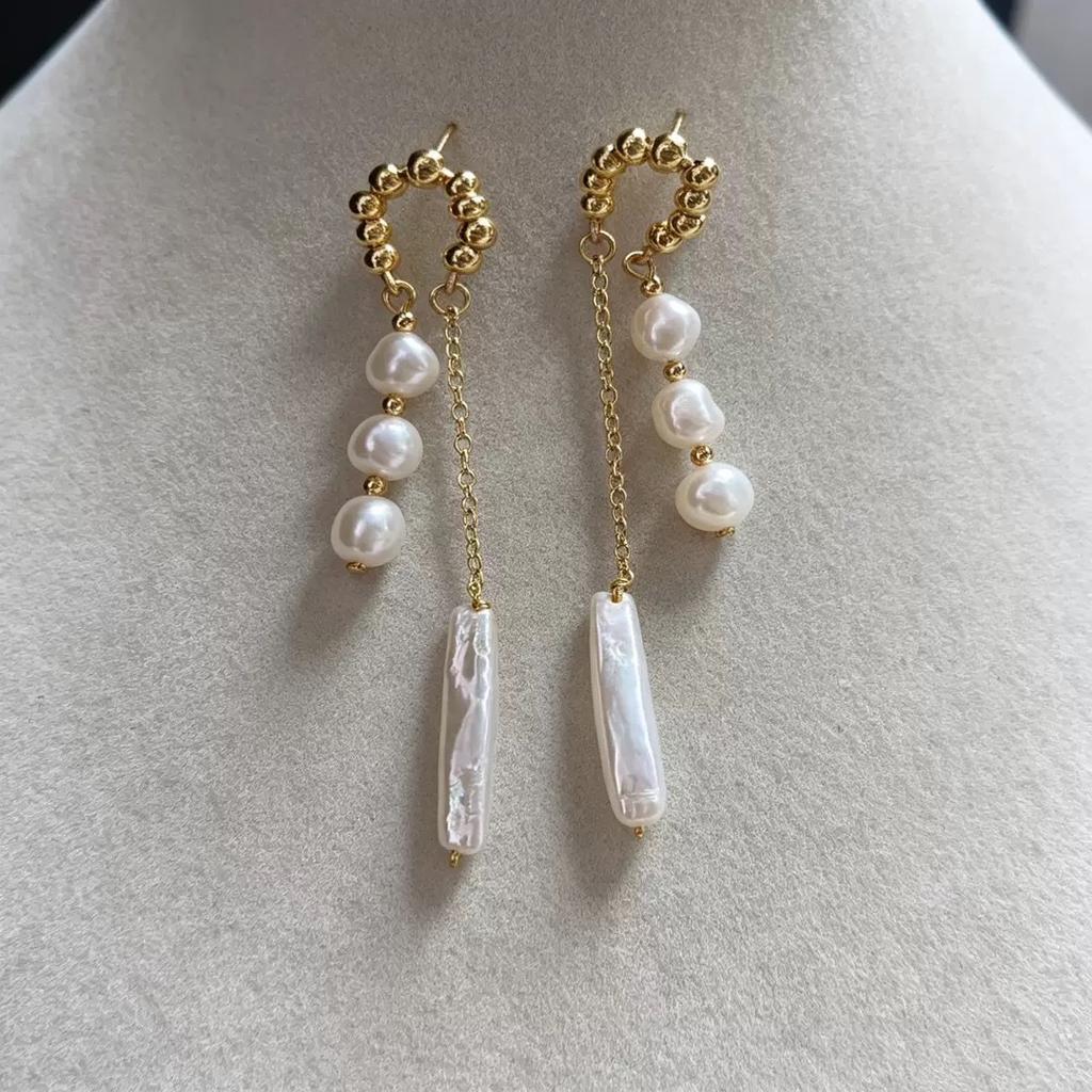 Baroque natural freshwater pearl earrings feature a niche female aura and a distinctive design, with an irregular fashion and exaggerated pendant