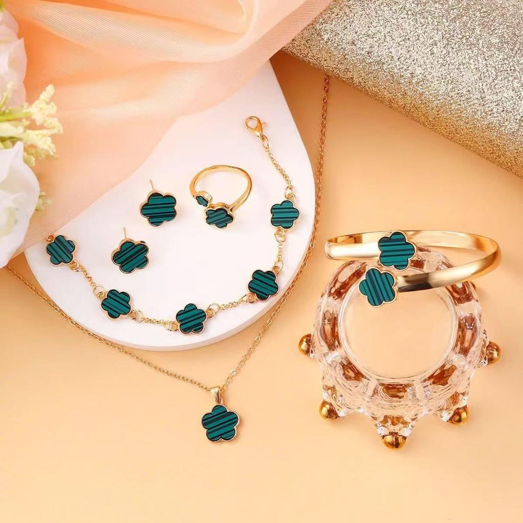 Elegant 5-Piece Flower Jewelry Set: Necklace, Bracelet, Earrings, and Ring.