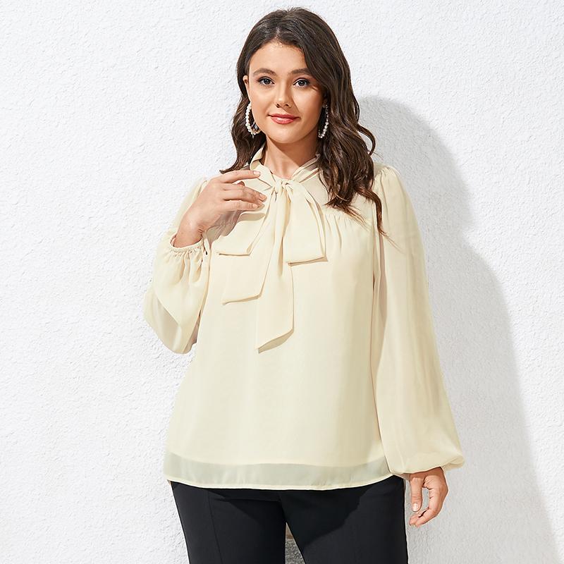 

Женская однотонная блузка с бантом и высоким низом