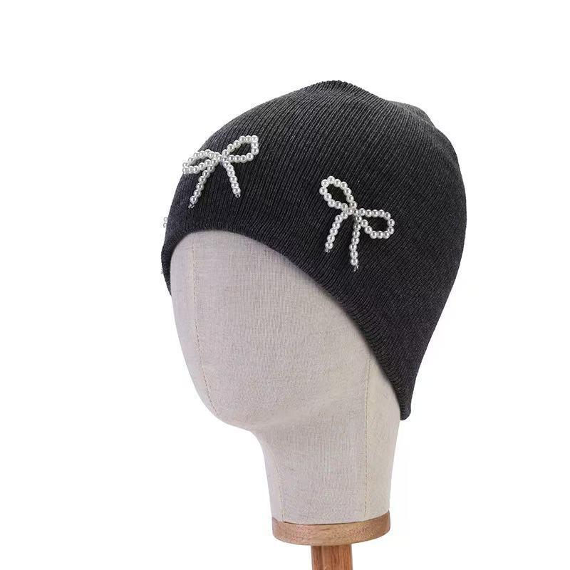 Pearl Bow Knit Hat: Trendy Korean-Style Autumn/Winter Pullover with Ear Protection.