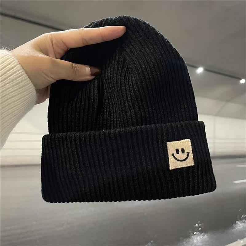 Devil smiley face label wool hat women's autumn and winter warm trend versatile ear protector black knitted hat