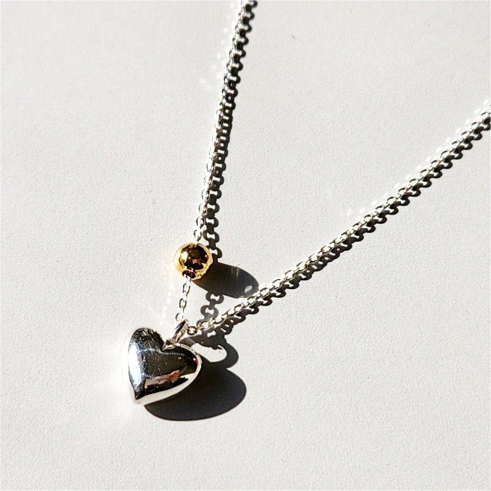 Two-tone Silver Necklace with a Heart Ball
