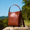New First-layer Cowhide Bag Women's Bucket Bag Design Sense Niche High-end Leather Commuting Versatile Women's Messenger Bag