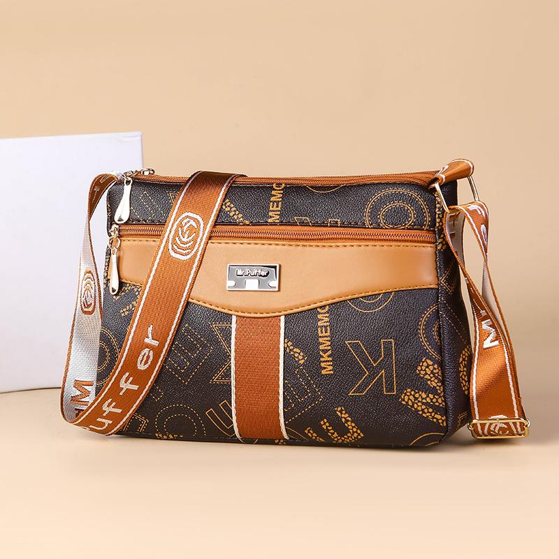 Middle-aged and Elderly Mother Buying A Large-capacity Multi-functional Shoulder Crossbody Bag In Spring