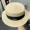Bow jazz straw hat women's summer outing seaside UV protection sun hat versatile flat top hat