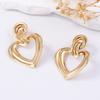 Simple, fashionable, exaggerated, individualistic, trendy, cold style, hollowed-out metal heart-shaped earrings, light luxury