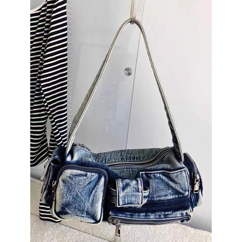 

New niche locomotive style multi-pocket armpit bag female hottie new retro handbag denim shoulder bag синій