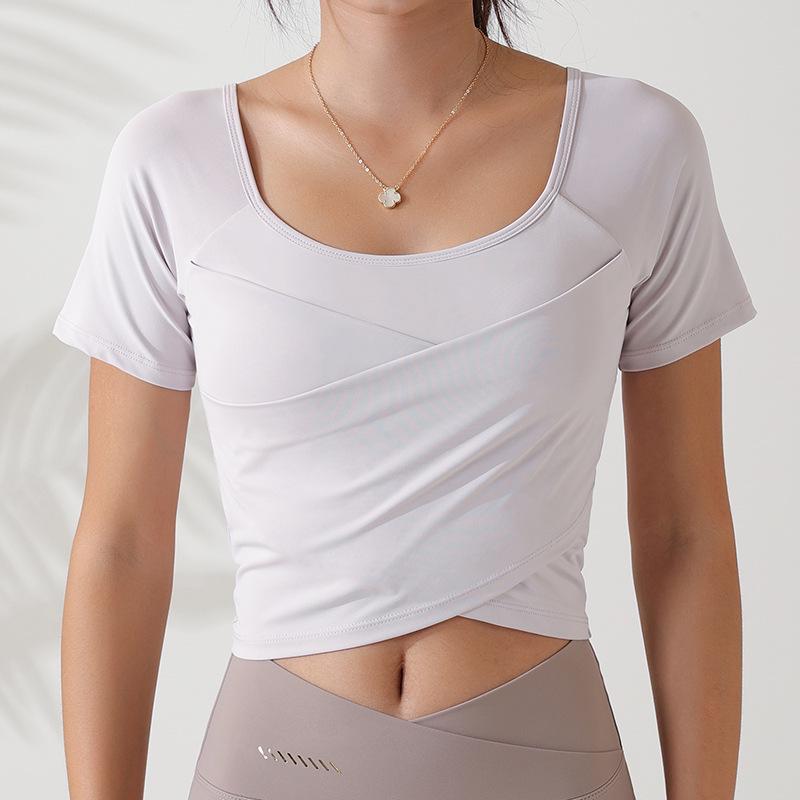 

Женский летний топ для фитнеса с коротким рукавом и нагрудными вкладышами Large кремовый