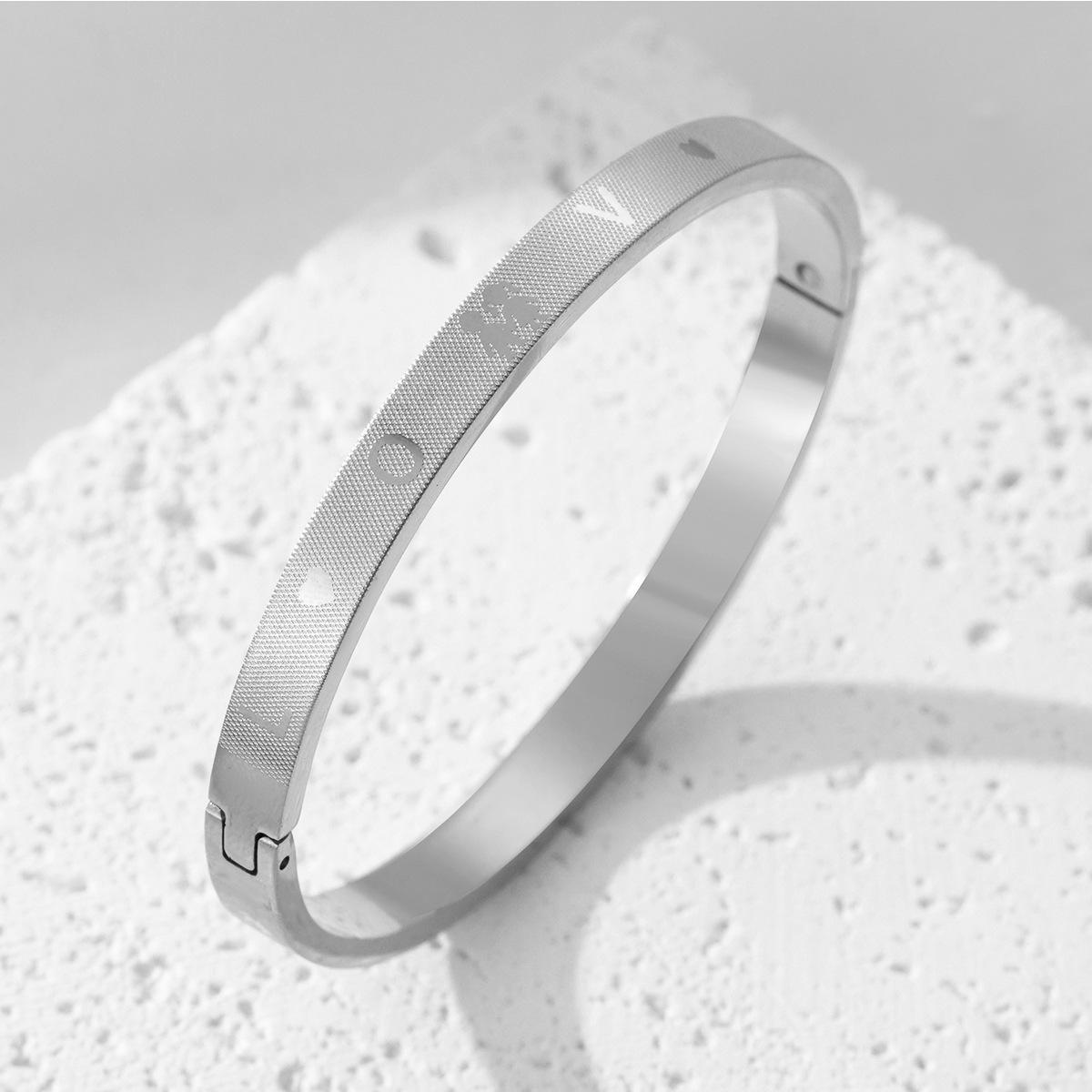 New titanium steel bracelet creative corrosion LOVE pattern grid buckle couple bracelet stainless steel decoration