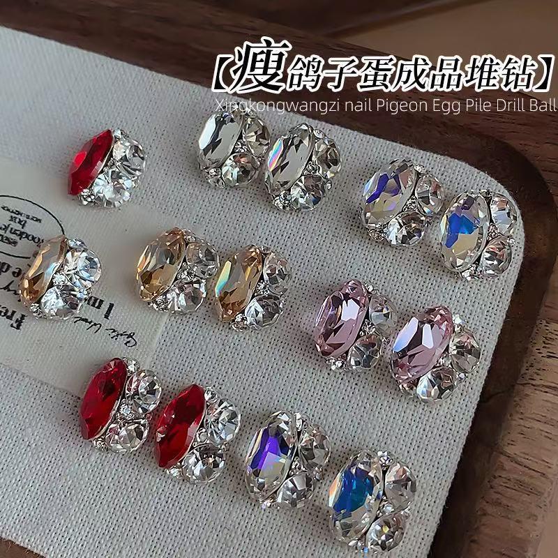 

Oval Crystal Nail Art: Sparkling Gemstone Accents