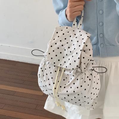 Sac à dos en nylon pour femme 2026 Nouveau style Niche Pois Ondulés Cordon de serrage Japonais Léger Sac d'école Femme