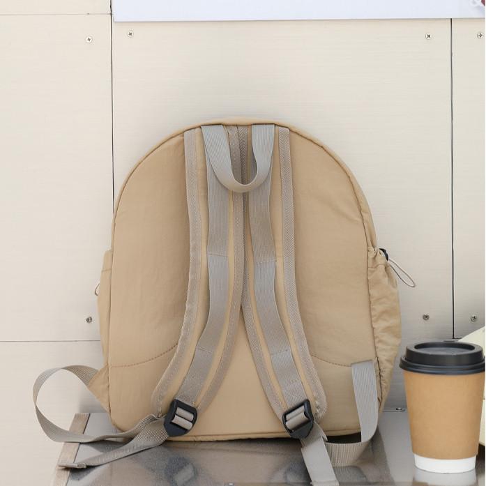 IELGY Korean version of casual literary canvas schoolbag, pleated nylon drawstring backpack, fashionable Oxford cloth backpack.