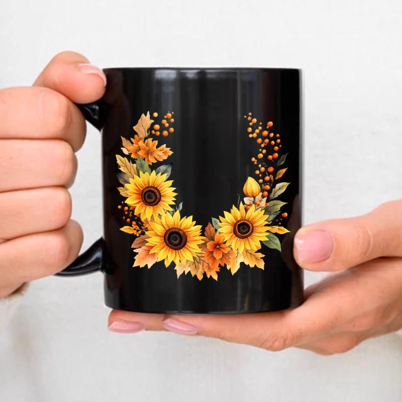 Black ceramic mug with sunflower and autumn leaves design for coffee, tea or everyday use чёрный