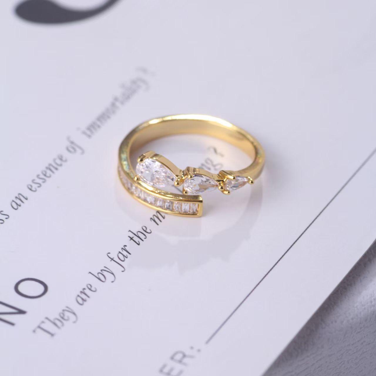 

И Шикарное Золотое Серебряное Регулируемое Открытое Кольцо с Уникальной Формой Капли Воды и Ощущением Роскоши Gold Drop Zirconia