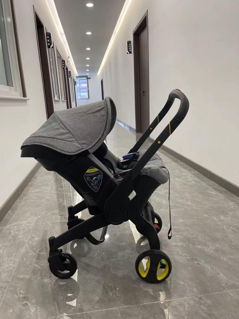 DOONA 4-in-1 Baby Carrier: Car Seat Cover, Rain Cover, Mosquito Net, Hanging Bag, Mummy Bag, Sunshade, Wheel Accessories.