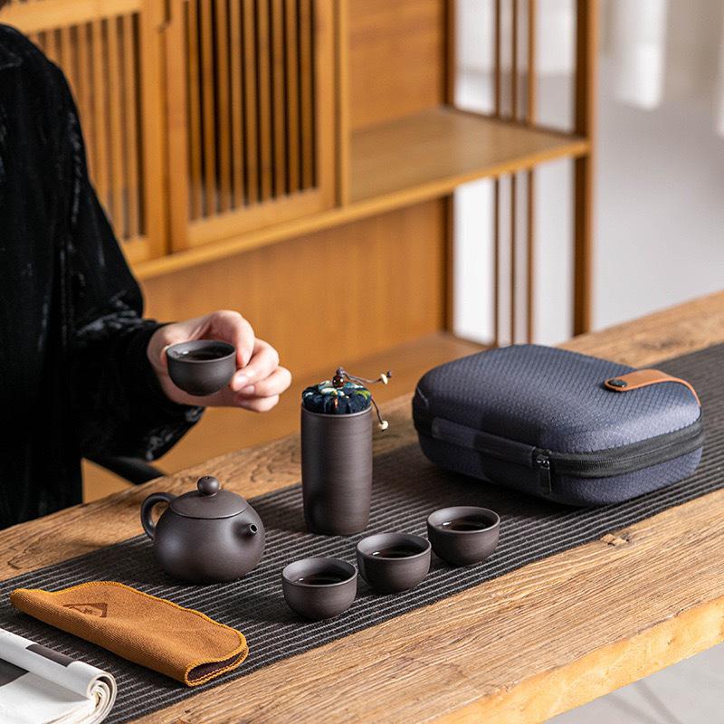 Portable Purple Clay Gongfu Tea Set: Includes 1 Pot and 4 Cups with Ceramic Dry Brew Travel Bag for Outdoor Use.
