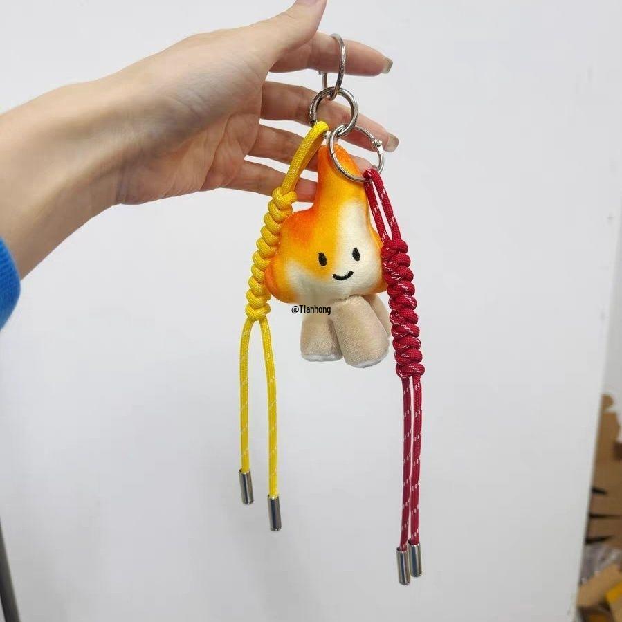 

Hand-Knitted Charcoal Fire Bag Pendant in Red and Yellow