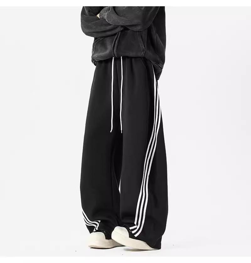 Pánské tmavě modré široké tepláky se třemi pruhy - Ležérní jarní high street trend