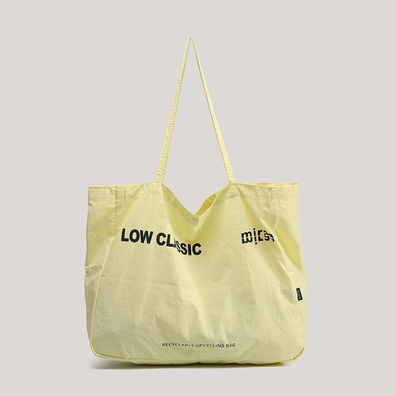 

2025 new large-capacity canvas bag Korean version portable shoulder bag commuter shopping cloth bag niche big tote