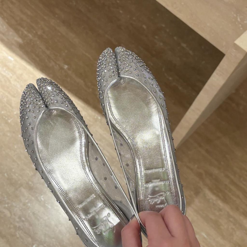 Fashion In 2025, A Woman With A Single Shoe, Wearing A Small Red Ballet Shoe And A Patent Leather Shoe With A Pig'S Foot Toe Separation