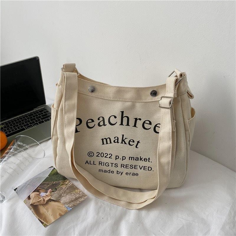 Stylish Korean Vintage Canvas Tote Bag For Women With Spacious Capacity And Trendy Lettering In Cream Brown Or Black