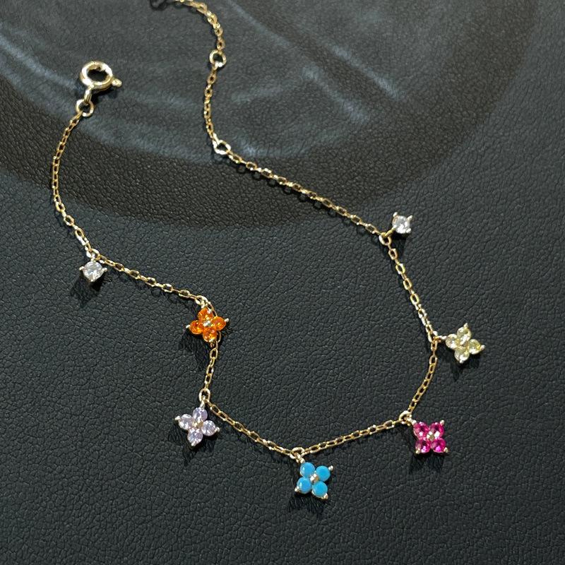 

Dopamine Four-Leaf Clover Bracelet in S925 Sterling Silver with Colorful Zircon – Retro Luxury and Versatile Style. 925 Silver