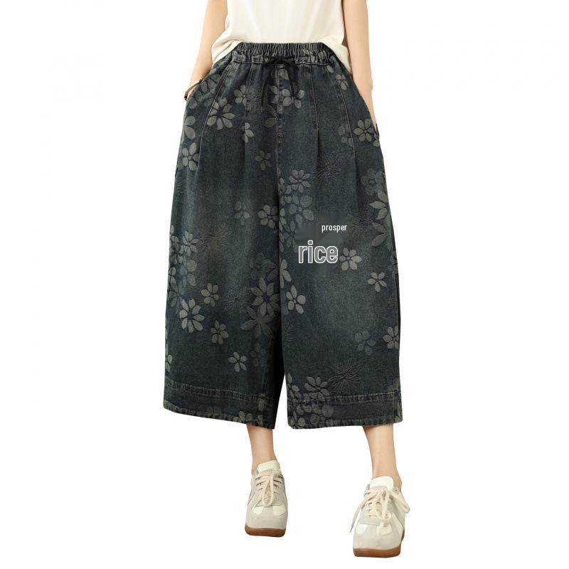 Pantaloni a zampa crop in denim jacquard floreale taglie forti
