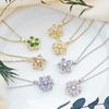 Elegant Zircon-Studded Rotatable Flower Pendant Necklace with Copper Inlay